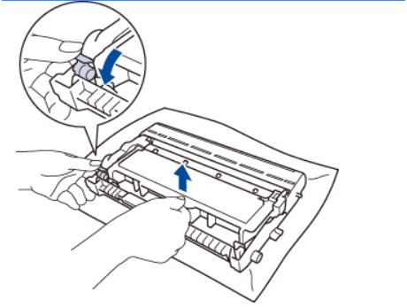 How to Press the green lock lever and remove the toner cartridge from the drum unit.